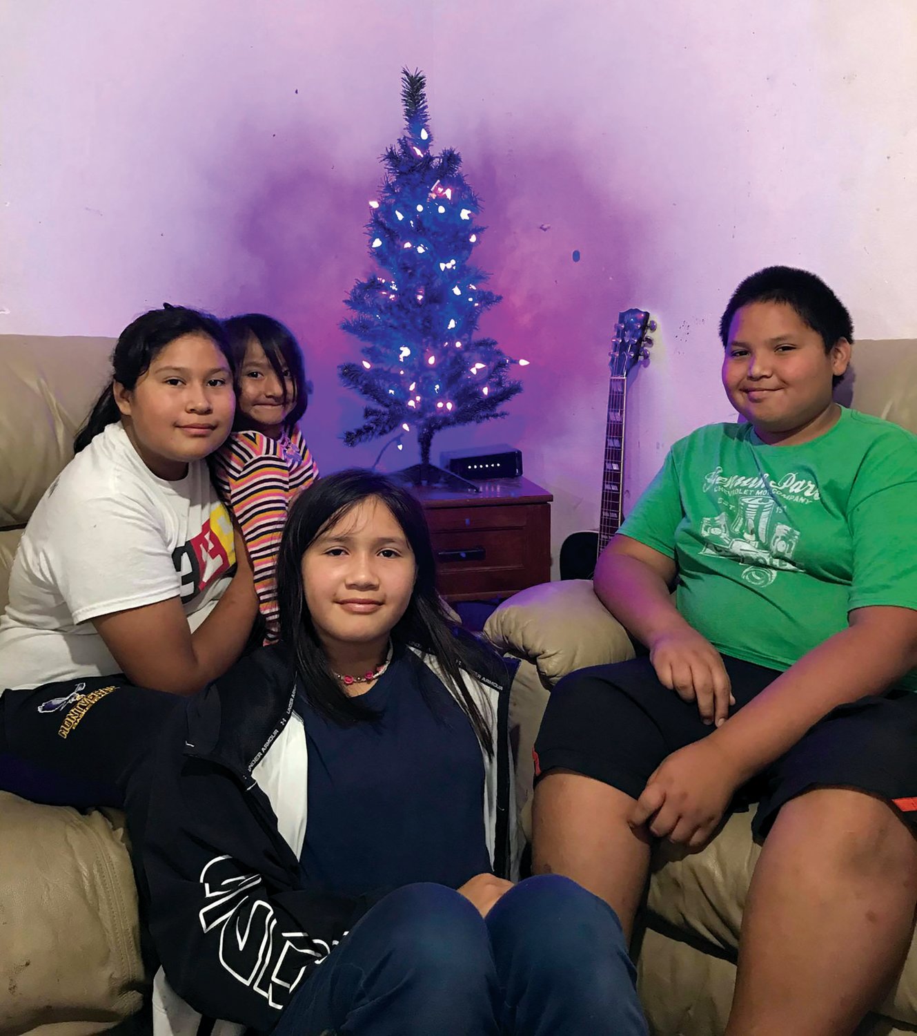Special to the Lake Okeechobee News
The Osceola children Noah (13), Sally (11), Eleanor(10) and Hapahnee (4) pose in front of their new Christmas tree.